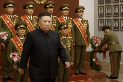 Kim Jong Un honors war dead.